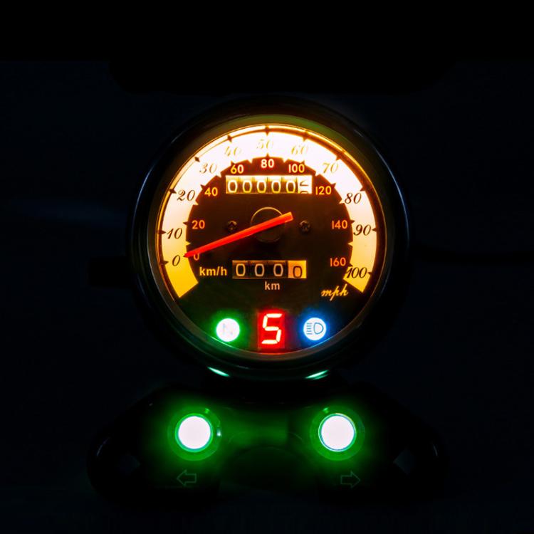 Backlit motorcycle speedometer with amber dial, green gear light, and blue indicator