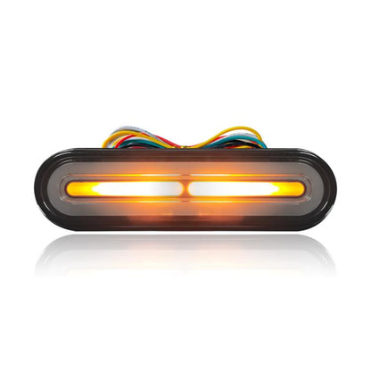 LED brake tail light with amber glow bar in black oval housing