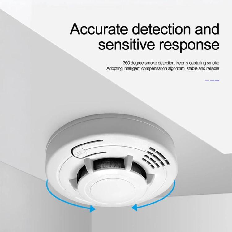 White ceiling-mounted smoke alarm with vent grille and indicator arrows