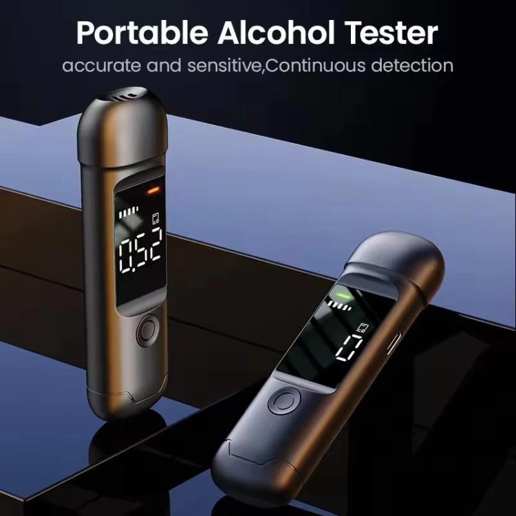 Portable breath alcohol tester in dark finish with lit screen and indicator bars