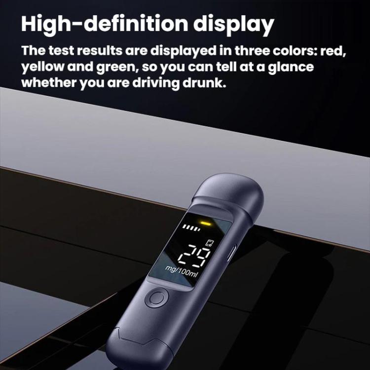 Dark portable breath alcohol tester angled view with digital results on screen