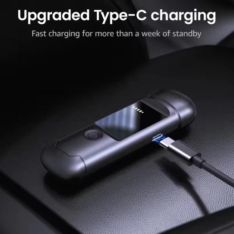 Portable breath alcohol tester charging with USB-C cable connected to dark device