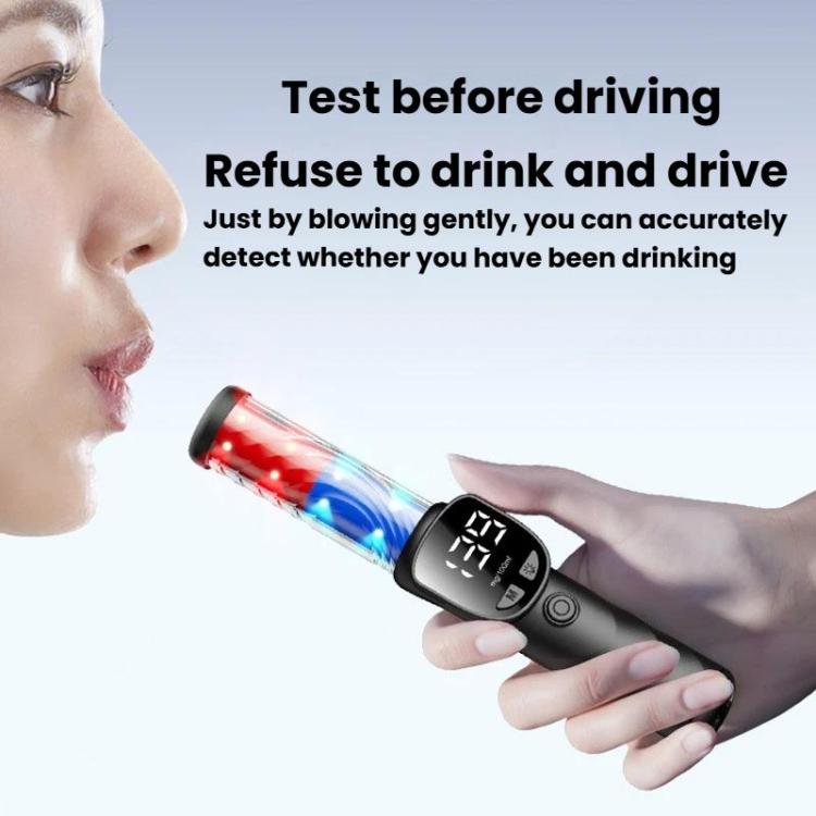 Handheld breath alcohol tester in a hand with digital LCD display