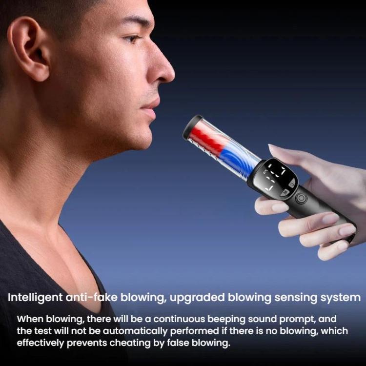 Handheld breath alcohol tester device held near mouth with LCD screen