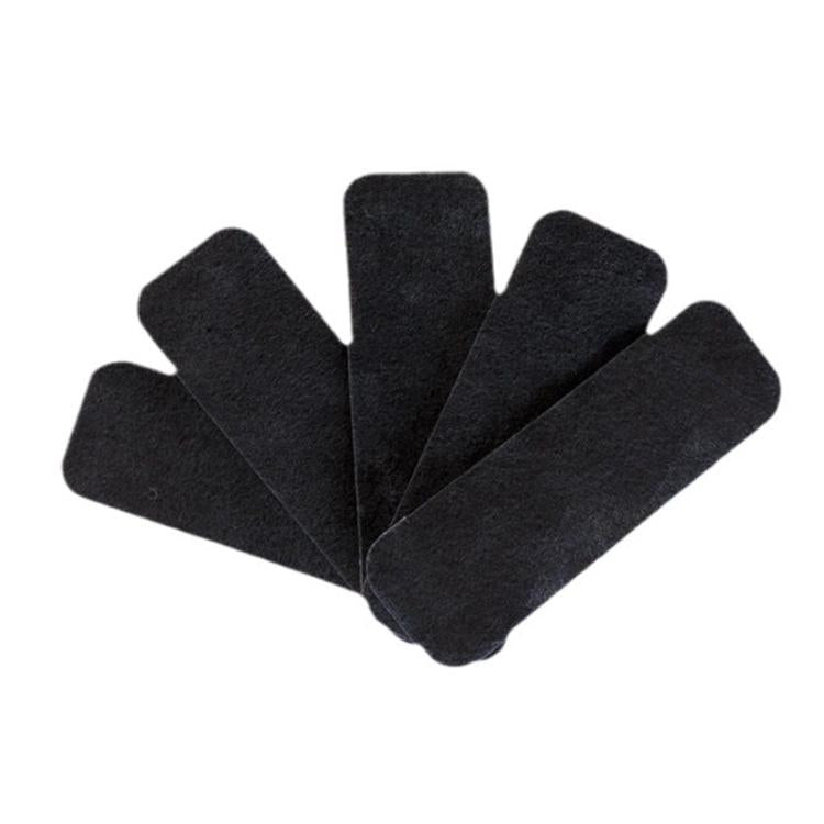 Five black activated carbon filter pads, oval pieces fanned together
