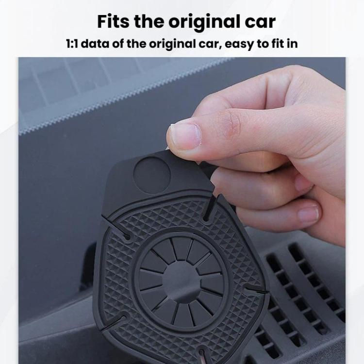 Black wiper hole protective cover being pressed into car wiper hole