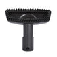 Close-up of black steam cleaner brush head with row of bristles and handle