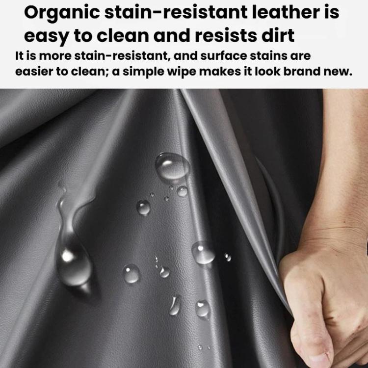 Stain-resistant leather-look cover in dark gray with water droplets and a hand