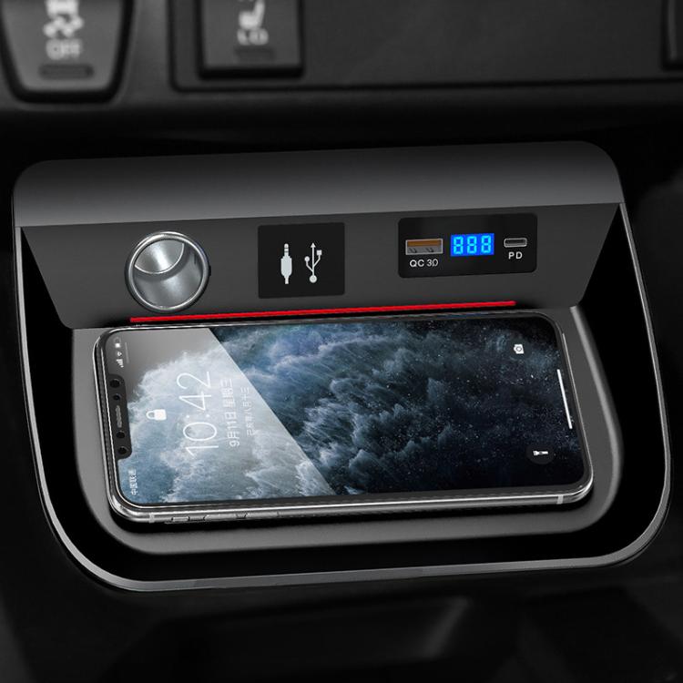 Wireless car charger bay with digital display and phone resting on charging surface