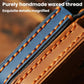 Close-up of blue and brown genuine leather key cover with waxed thread stitching