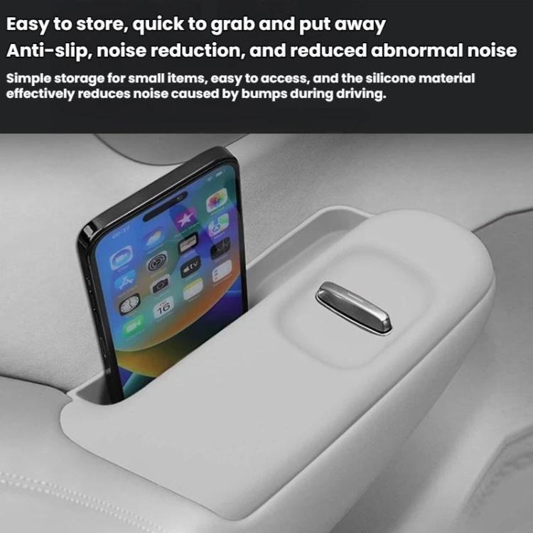 White silicone anti-slip pad on car center console with phone storage area