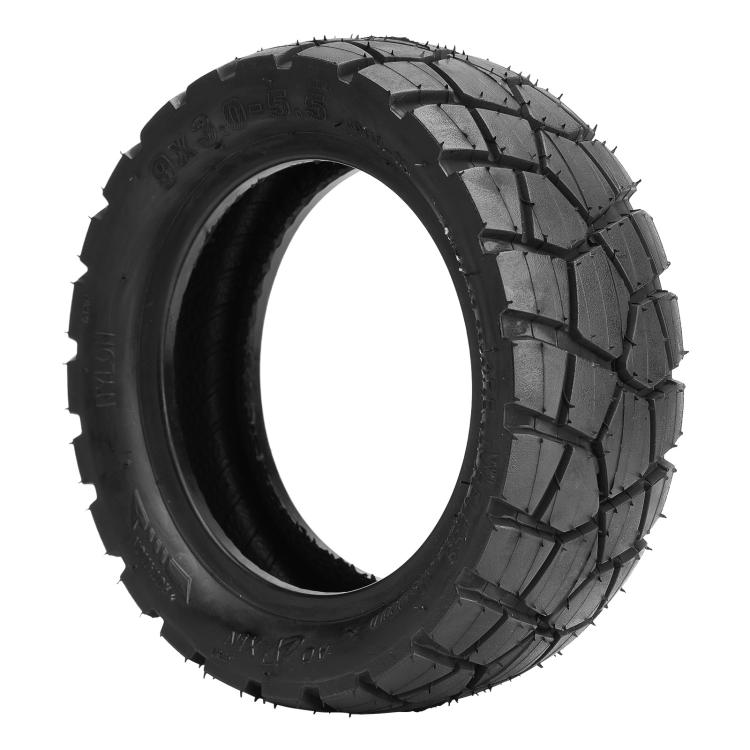 Black off-road tubeless scooter tire with deep tread blocks and rugged sidewall