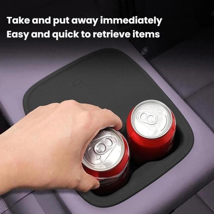 Black silicone bottle holder holding two cans in anti-slip cup openings