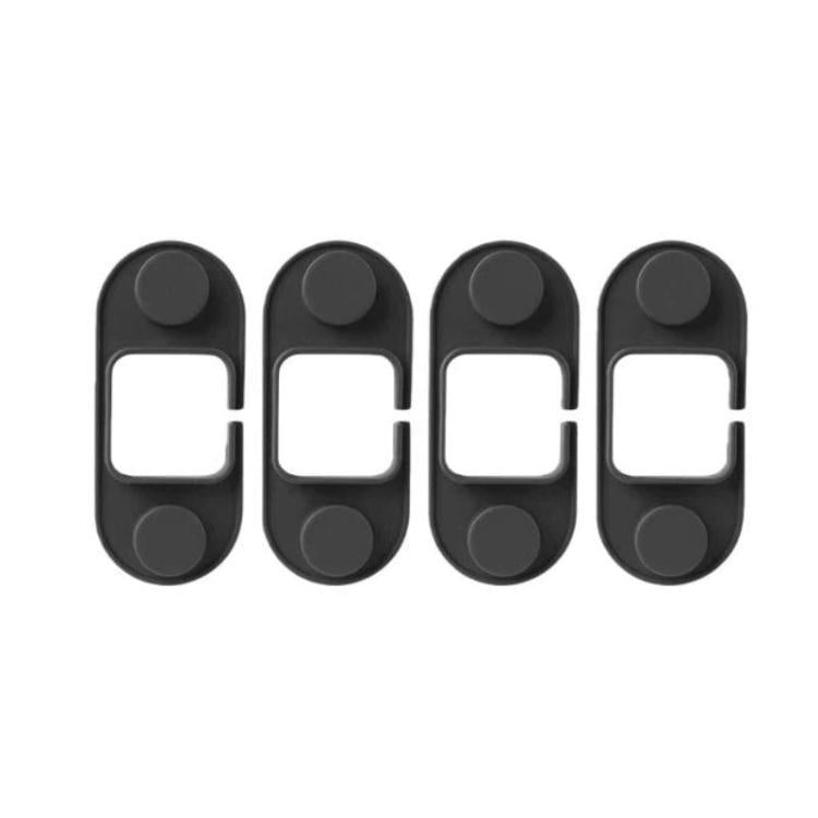 Set of four black silicone door limiter covers with oval shape and square window openings.