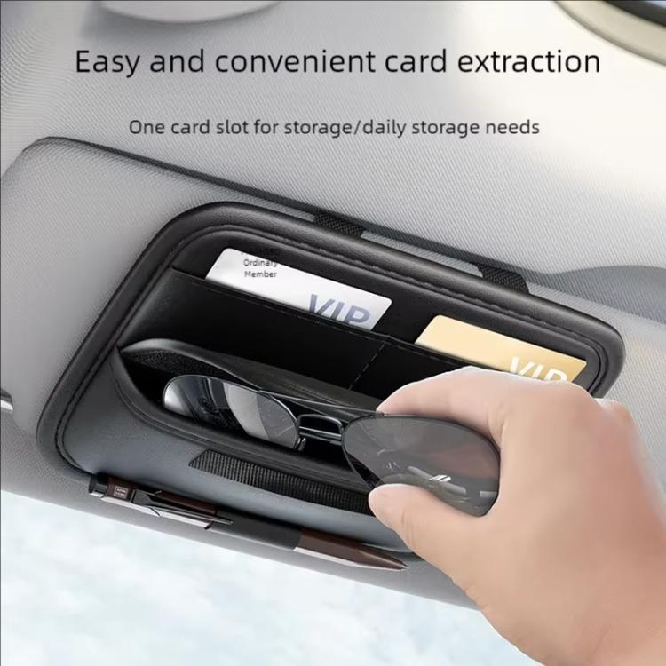 Black sun visor organizer with card pocket and eyeglass slot holding glasses