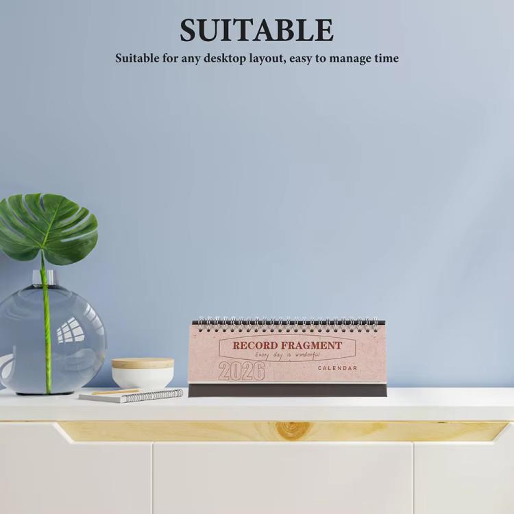 Small 2026 mini desk calendar on a tabletop shelf with flip stand