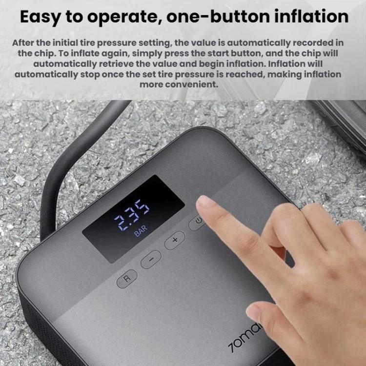 Hand pressing controls on a car tire inflator with LED pressure display
