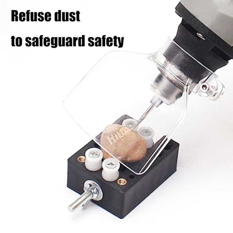 Transparent dust shield guard mounted on electric grinder for cutting and engraving