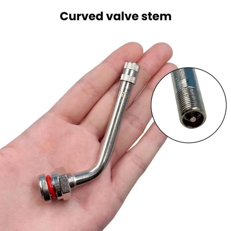 Curved tire valve held in hand, metal stem with blue/red base ring