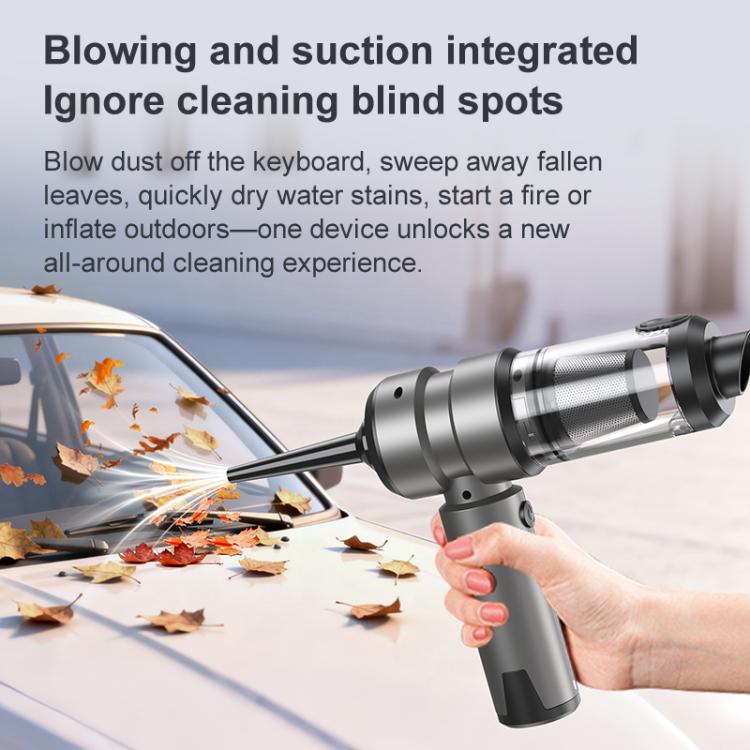 Gray cordless vacuum cleaner with hand-held nozzle blowing and sucking debris outdoors