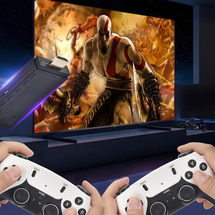 Two hands holding white wireless controllers in front of a game console