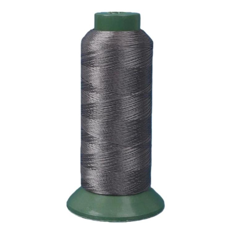 Nylon sewing thread spool, silver gray 3-strand thread on green base.
