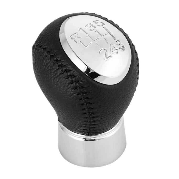 Black leather-look gear shift knob with chrome base and engraved shift diagram on top