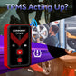 Red and black TPMS tool in hand near a car tire with activation signal