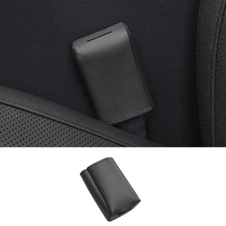 Grey leather car seat belt buckle protector cover with stitched edges.