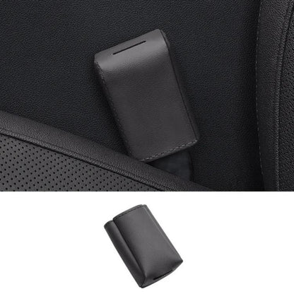 Grey leather car seat belt buckle protector cover with stitched edges.