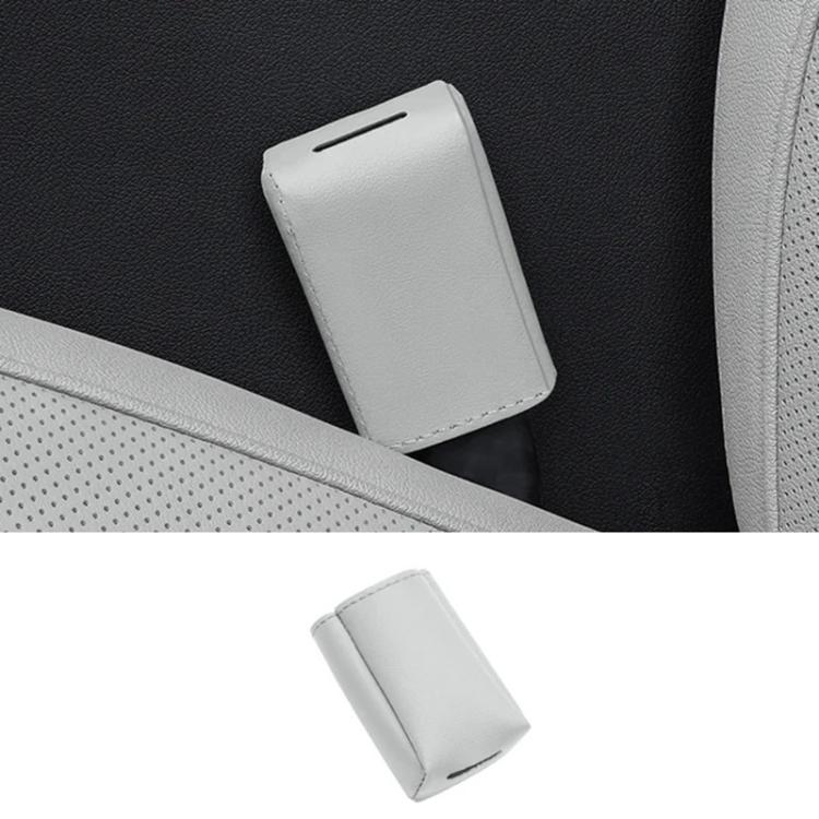 Light grey leather car seat belt buckle protector cover, rectangular with open top.