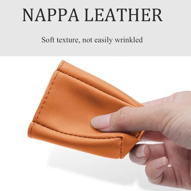 Orange leather car seat belt buckle protector cover close-up with stitching.
