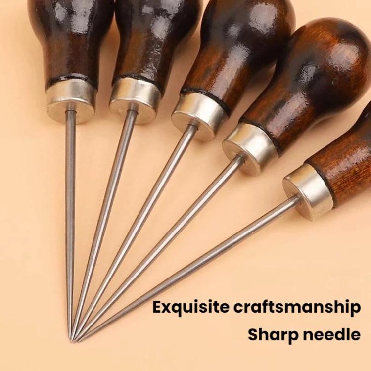 Close-up of wooden-handled awls with silver ferrules and sharp steel needles