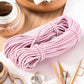 Pink-and-white striped elastic waistband tape coil for sewing waistbands
