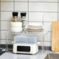Clear acrylic rack with chrome legs for plates, pots, and kitchen storage