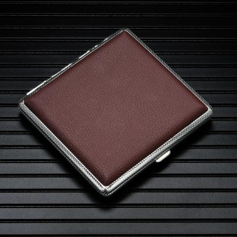 Brown leather cigarette case with metal trim, hinged lid closed.