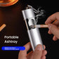 Portable metal-lined pocket ashtray, silver with cigarette inserted and smoke