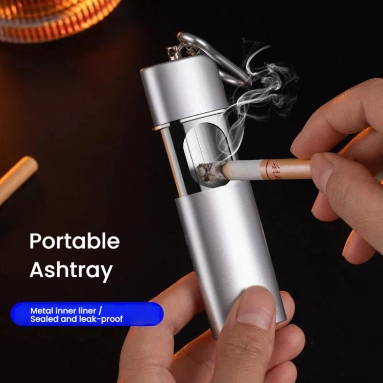 Portable metal-lined pocket ashtray, silver with cigarette inserted and smoke