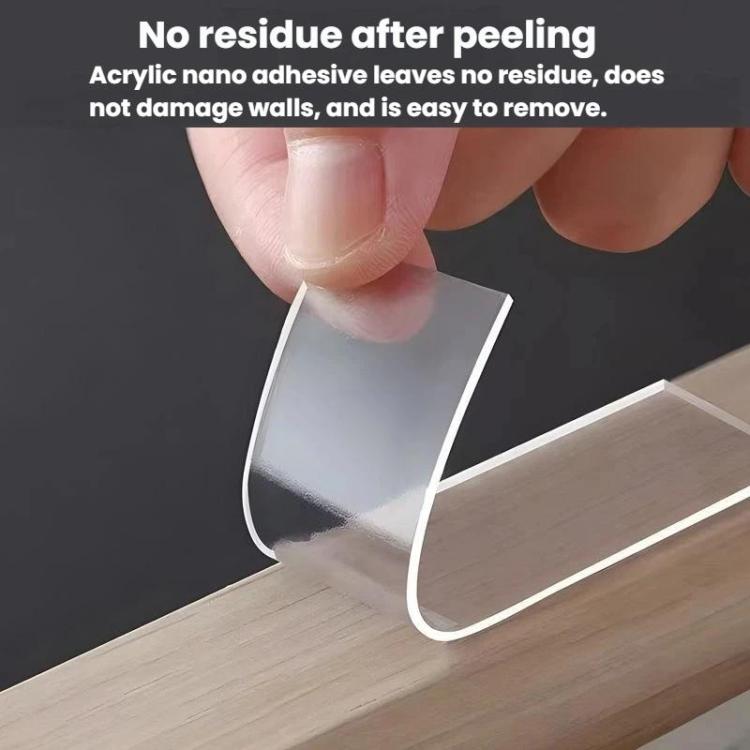 Transparent double-sided adhesive pad with peeled backing, applied to wood