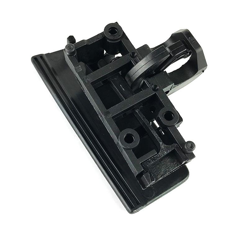 Black glove box handle base bracket with screw holes and linkage