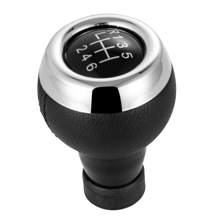 Black leather 6-speed manual shift knob with chrome top and gear numbers 1–6 & R