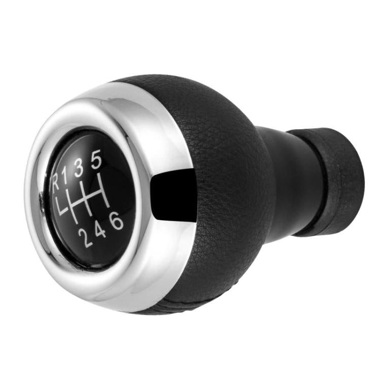 Black leather manual shift knob with chrome bezel, showing gear numbers R and 1–6
