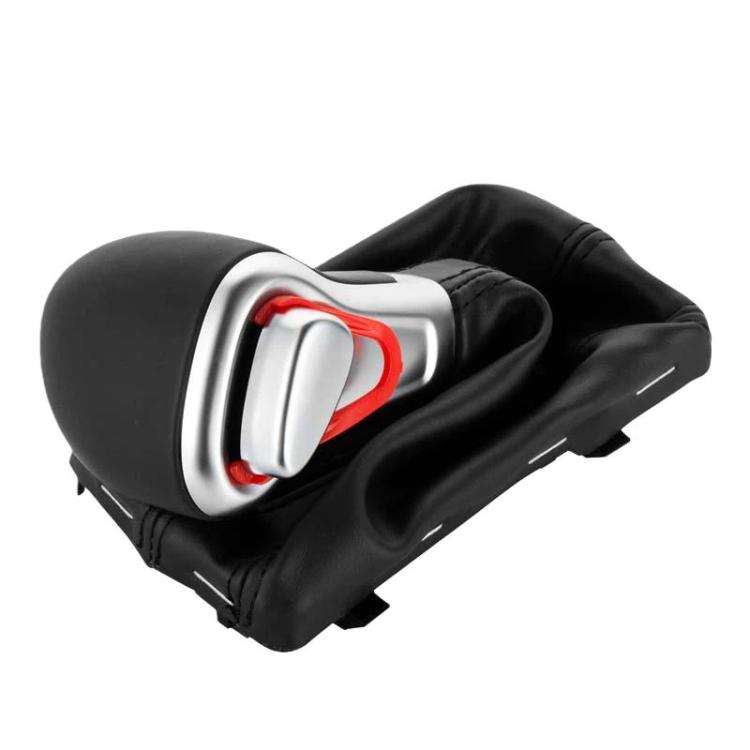 Automatic gear shifter knob with black boot and silver bezel with red insert detail.