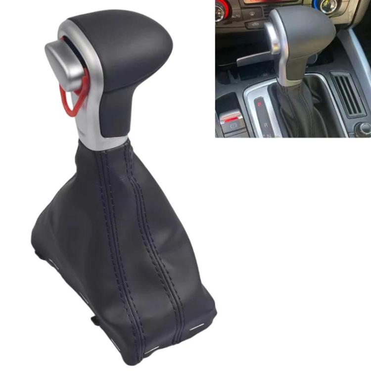 Automatic shifter knob with black boot and blue stitching, silver ring with red insert.