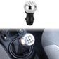 Installed gear shift knob in car interior, chrome top with 1–5 and R labels