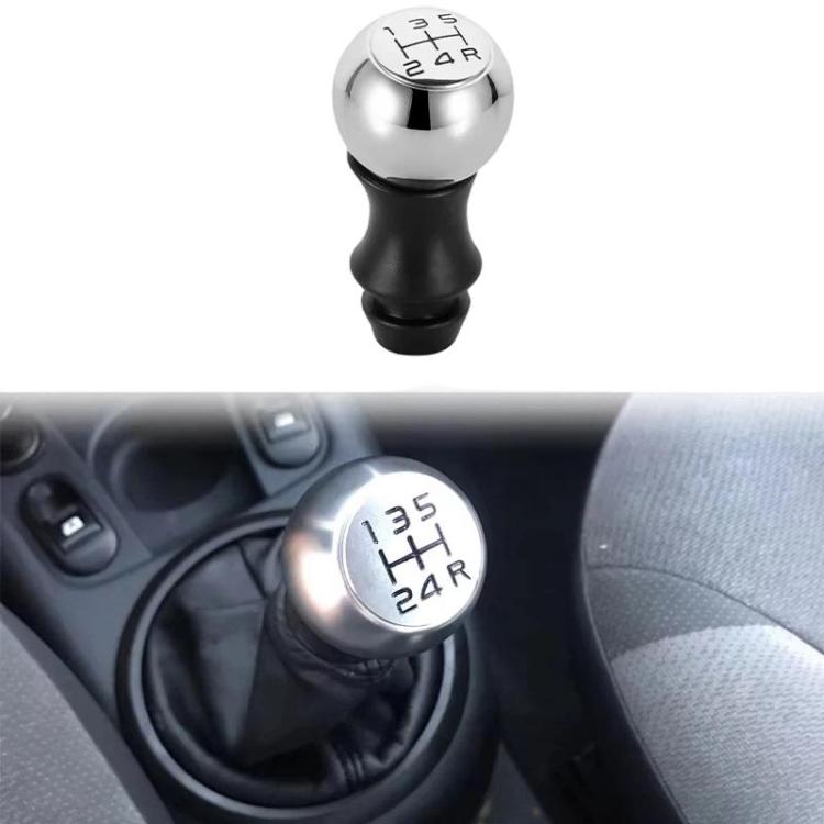 Installed gear shift knob in car interior, chrome top with 1–5 and R labels