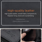 Black compact wallet with embossed brand logo and zip edge detail