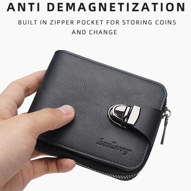 Black compact wallet held in hand, zip closure and metal clasp strap detail