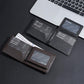Compact leather wallet showing multiple card slots and a transparent ID window, open
