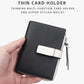 Black compact snap wallet with white front tab and side zipper coin pocket pull